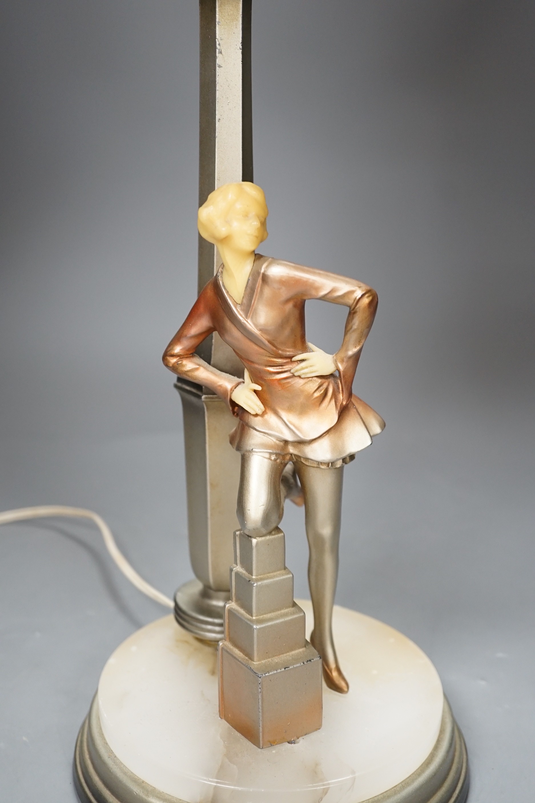 An Art Deco Cold painted spelter and composition figural table lamp and glass shade, 67cm high